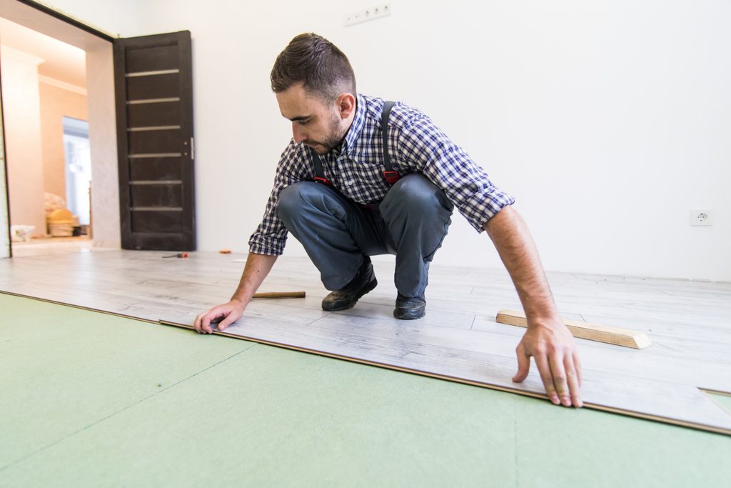 Selecting Waterproof Luxury Vinyl Plank vs. Engineered Tile Subfloors in Berlin Basements shown in a realistic Berlin, NJ residential construction setting.